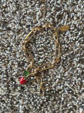 Canvas Jewelry Gold Tone Strawberry and Bow Charm Bracelet